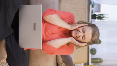 Vertical-video-of-Woman-sending-wrong-mail-on-laptop.-Can't-get-mail-back.